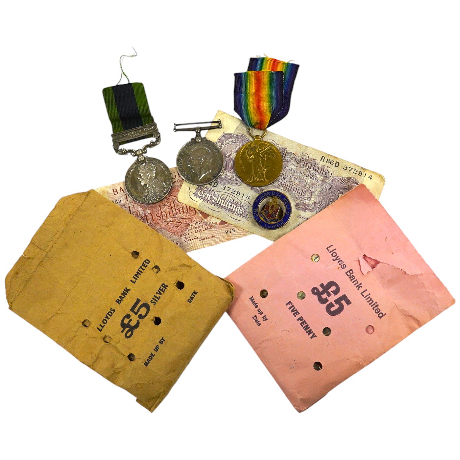 A First World War three medal group awarded to Pte. H. Hood R.W. Kent comprising; an India medal with bar for Afghanistan N.W.E. 1919, a War Medal and Victory Medal, plus an additional Victory Medal awarded to 2. Lieut.